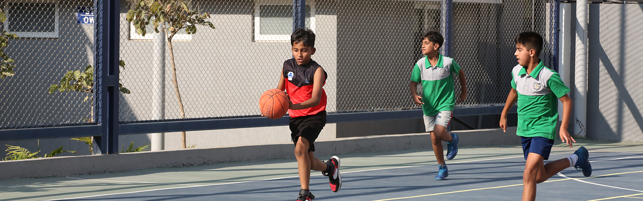 Basketball players on outdoor court